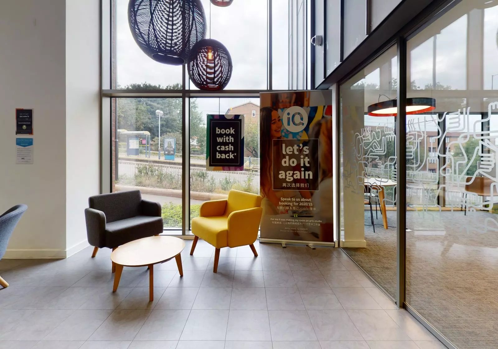Two armchairs and coffee table lounge area at iQ Century Square in Sheffield Student Accommodation