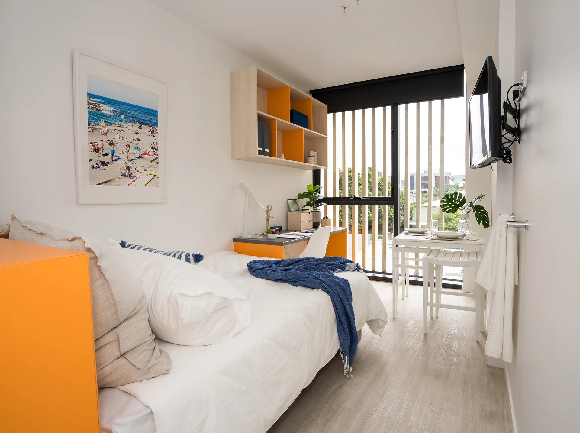 Bed desk shelves table TV bedroom at Scape Merivale in Brisbane Student Accommodation