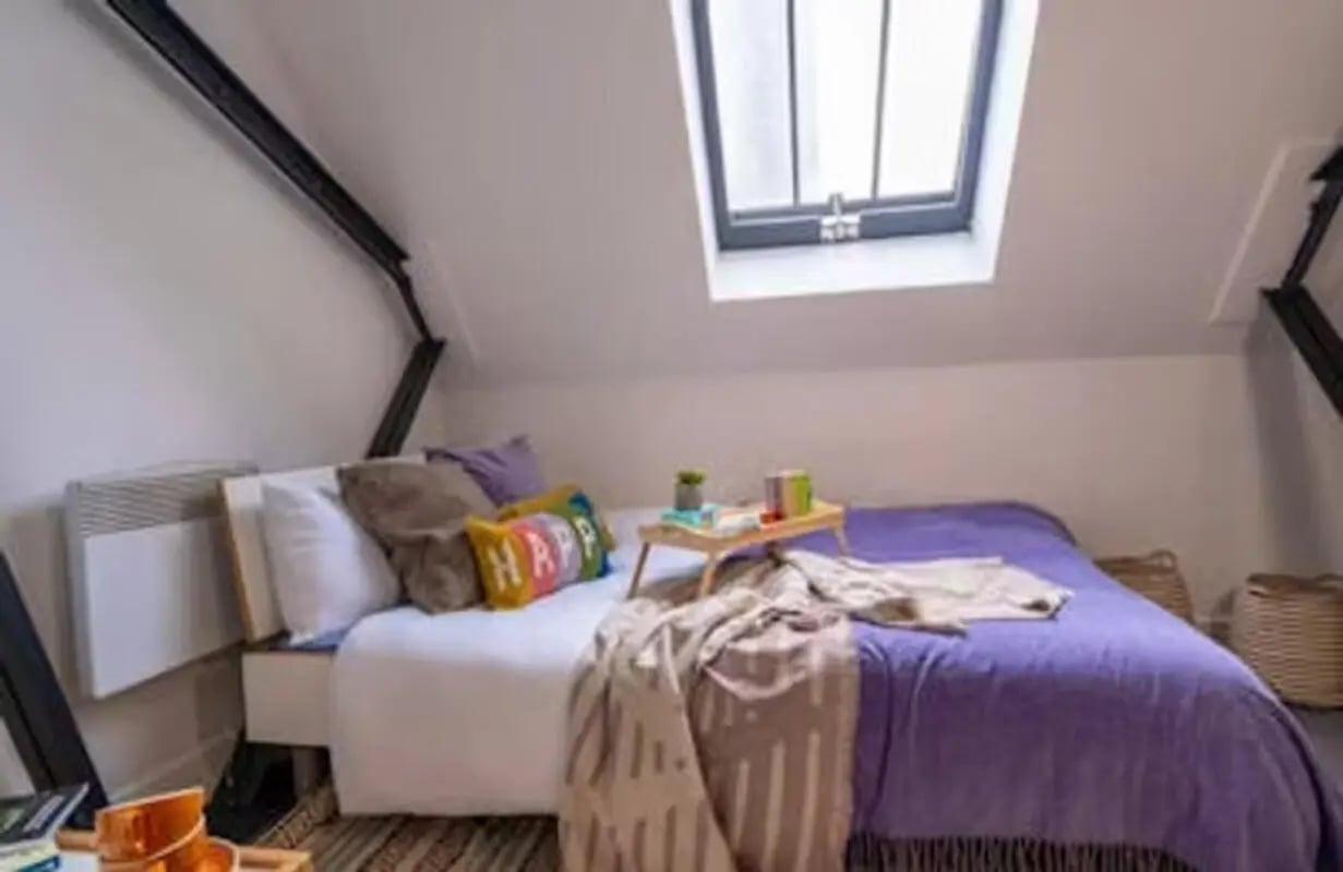 Bed pillows tray heater window bedroom at The Old Fire Station - Birmingham in Birmingham Student Accommodation