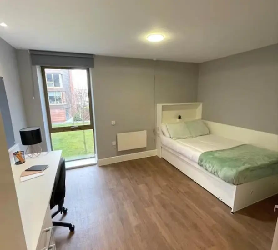 Bed desk lamp and window bedroom at Tramways in Chester Student Accommodation