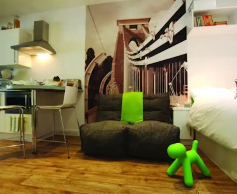 Kitchen counter sofa and bed student accommodation room at College Green in Bristol Student Accommodation