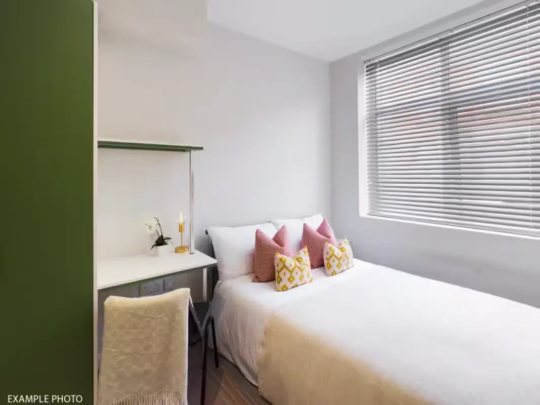Bed desk chair and pillows bedroom at 219 Leek Road in Stoke-On-Trent Student Accommodation