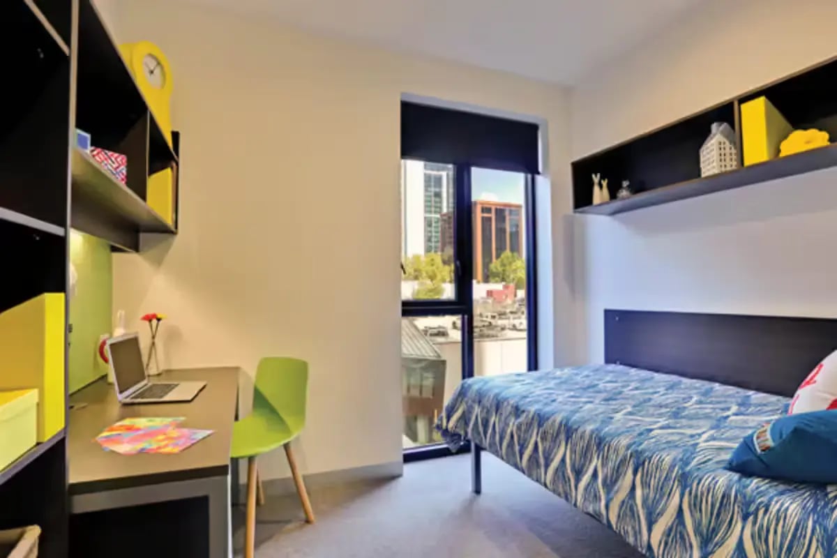 Desk laptop chair bed shelves bedroom at Scape Melbourne Central in Melbourne Student Accommodation