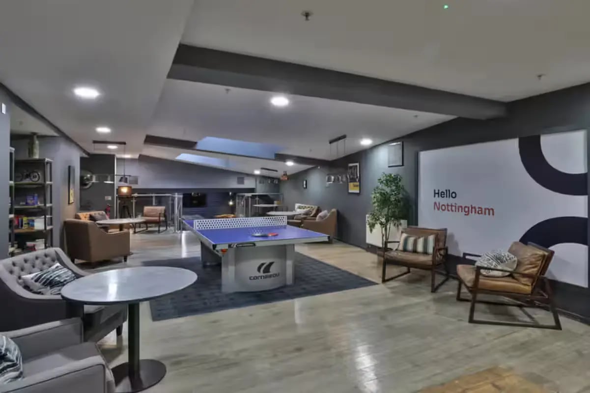 Ping pong table lounge area with seating living room at The Frontage in Nottingham Student Accommodation