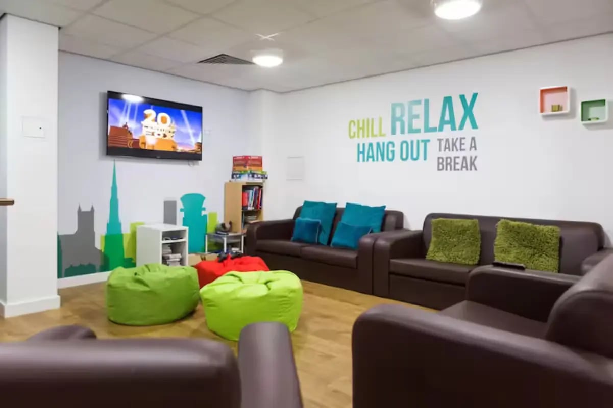 Sofa beanbags television and wall art lounge at St Lawrence House in Bristol Student Accommodation