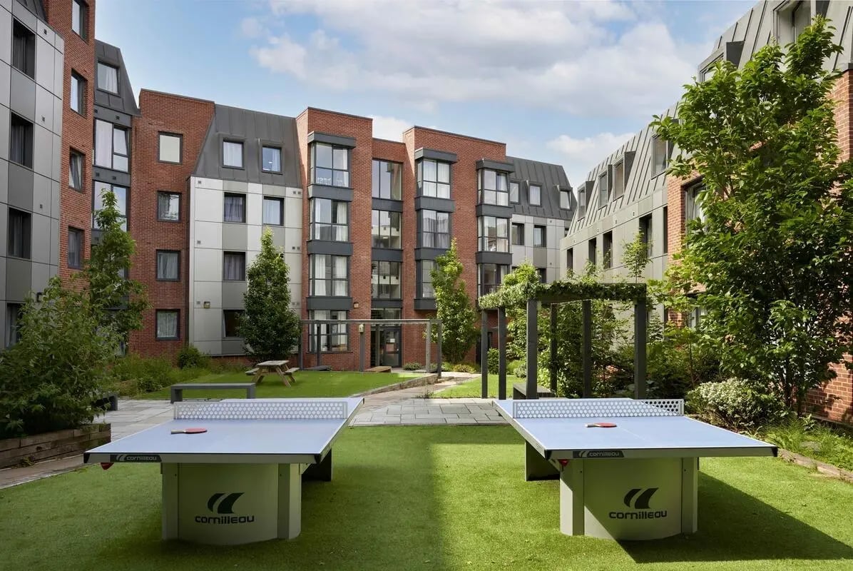 Two ping pong tables on lawn exterior at Asa Briggs House in Leeds Student Accommodation