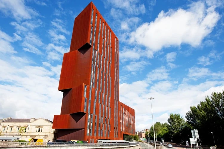 Modern rust colored student accommodation tower exterior at Broadcasting Tower in Leeds Student Accommodation