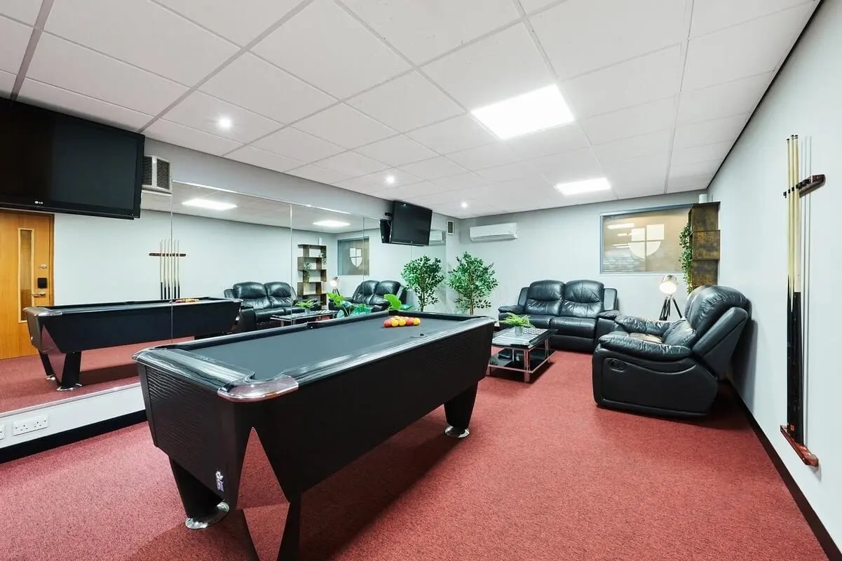 Pool tables sofas armchairs and televisions common room at The Moor in Sheffield Student Accommodation