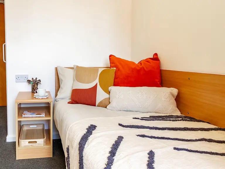 Bed with pillows bedside table bedroom at Yugo Park Court in Lincoln Student Accommodation