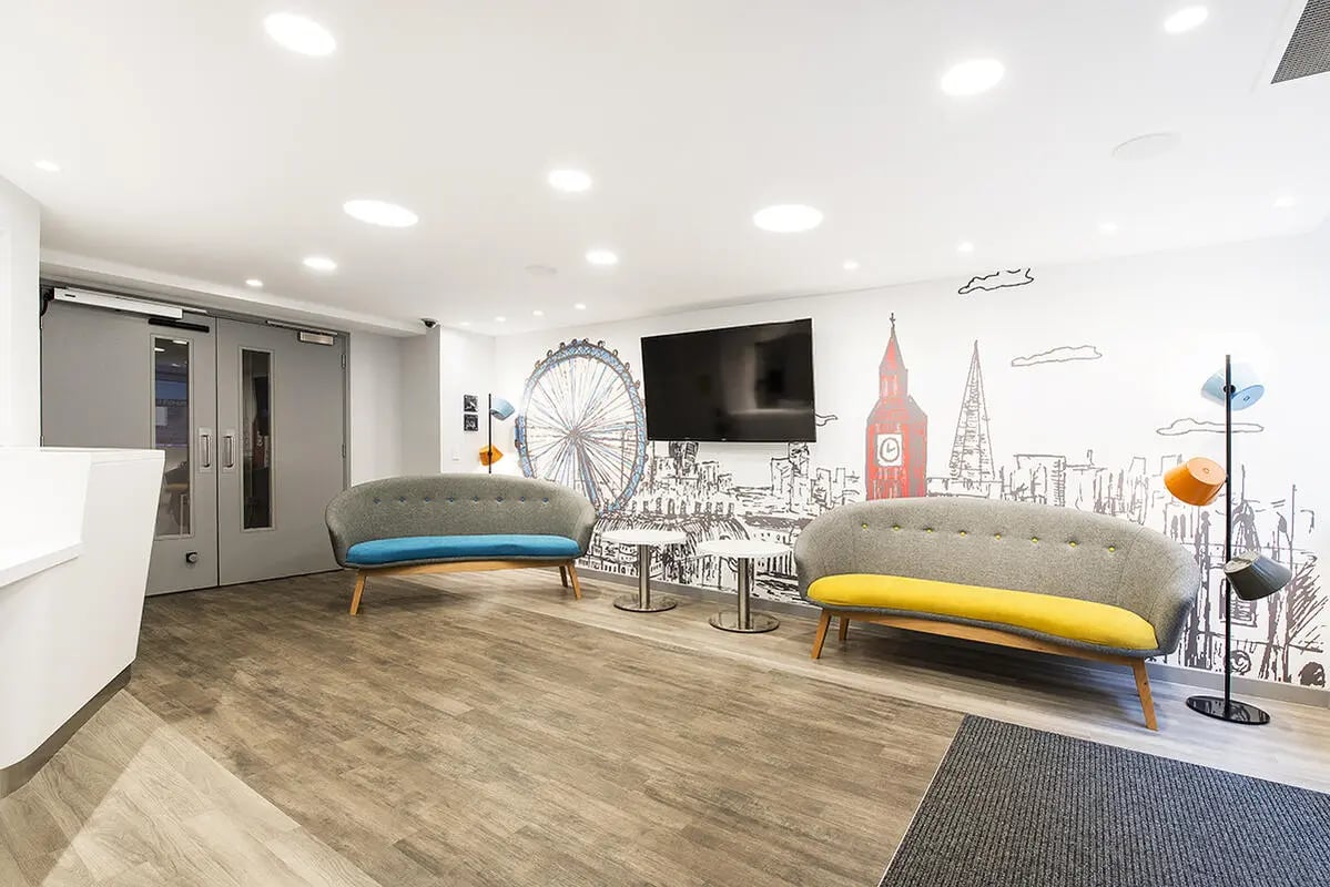 Two sofas television London mural common area at Yugo Therese House in London Student Accommodation