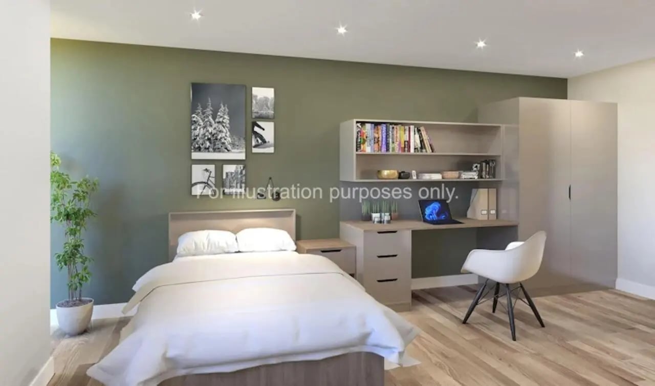 Bed desk wardrobe and chair bedroom at Waterloo House in York Student Accommodation