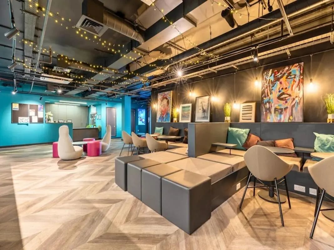 Modern lounge area with sofas and artwork living room at Crown House Brighton in Brighton Student Accommodation