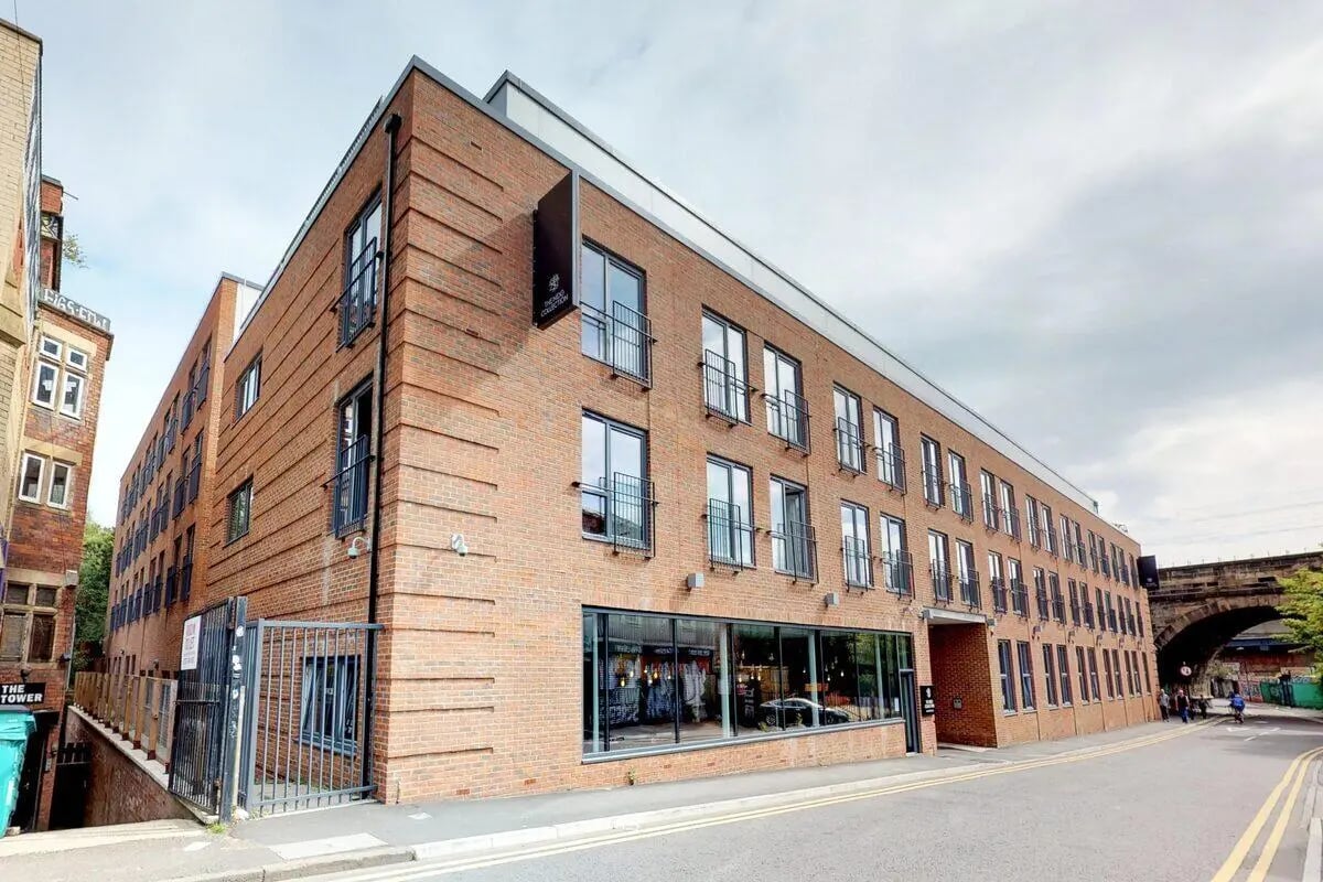 Brick student accommodation with balconies and large windows exterior at Stepney Yard in Newcastle Upon Tyne Student Accommodation