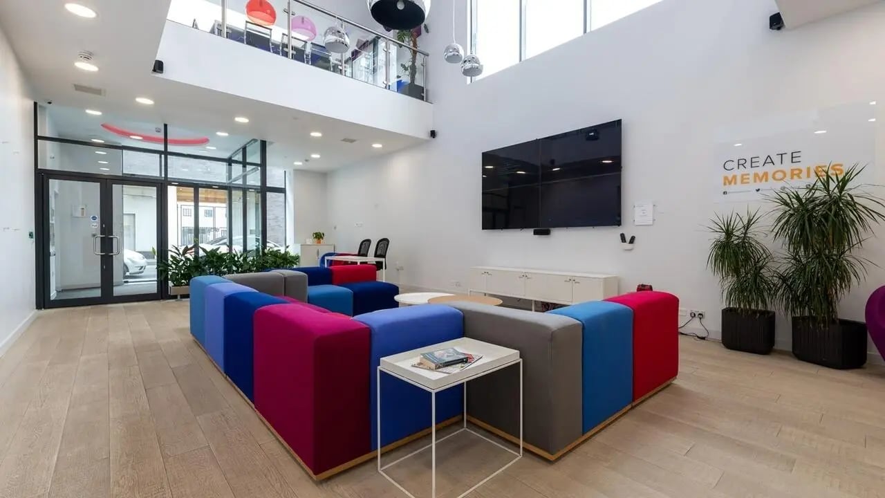 Modular sofa wall mounted tv and plants lounge area at Collegiate Middle Street in Portsmouth Student Accommodation