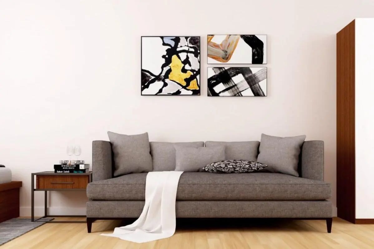 Grey sofa with artwork above living room at Pavillion - Birmingham in Birmingham Student Accommodation
