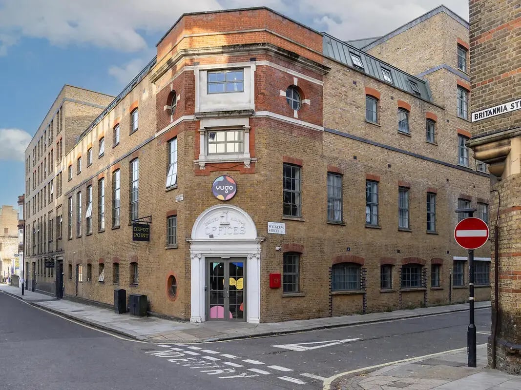 Building exterior with offices entrance and street exterior at Depot Point in London Student Accommodation