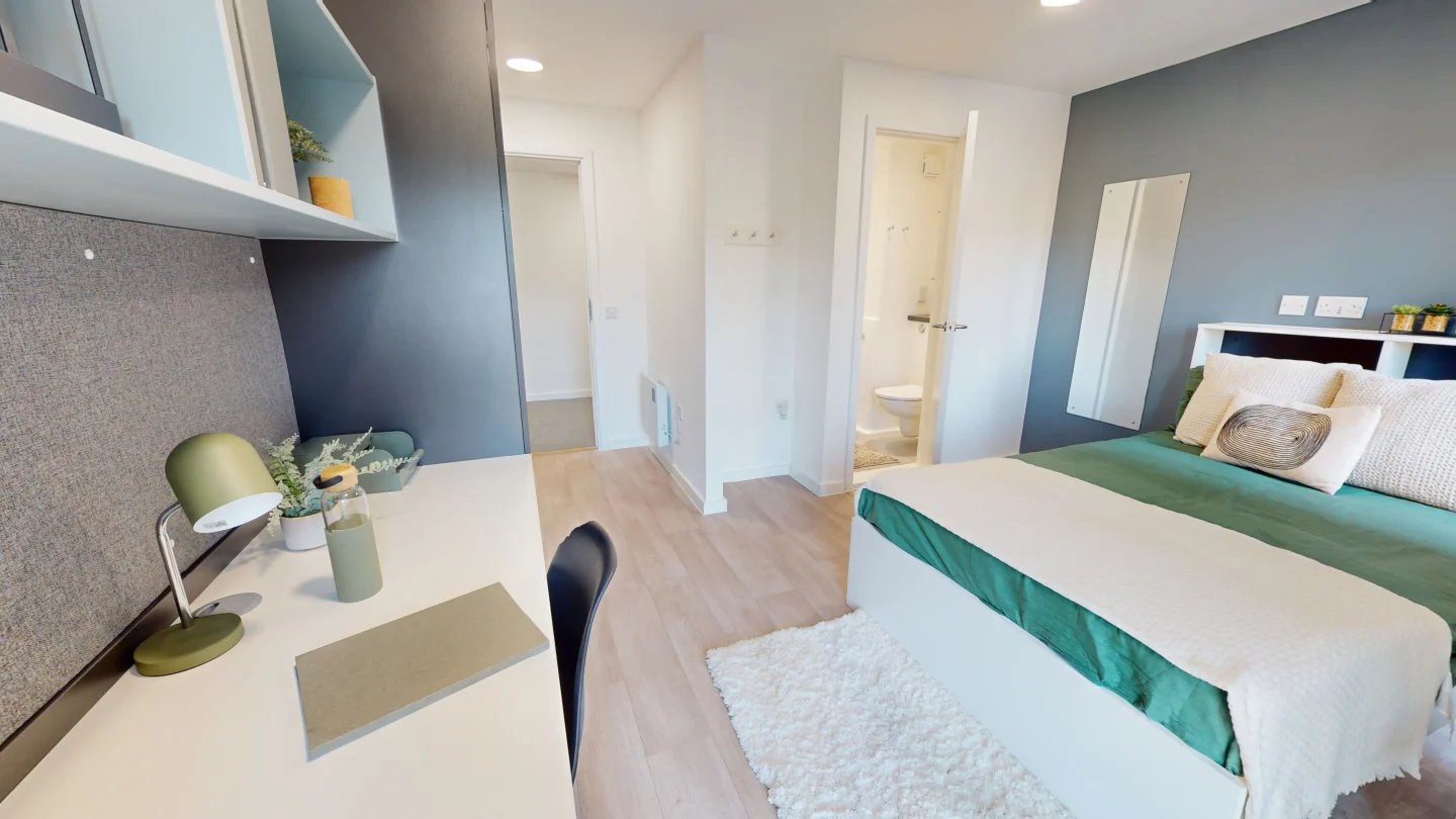 Desk lamp shelves bed and bathroom Bedroom at Enso in Colchester Student Accommodation