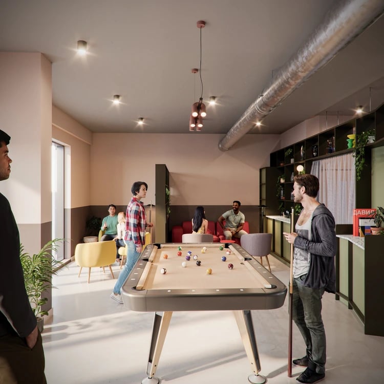 People playing pool in common area recreation room at Burnet Point in Edinburgh Student Accommodation