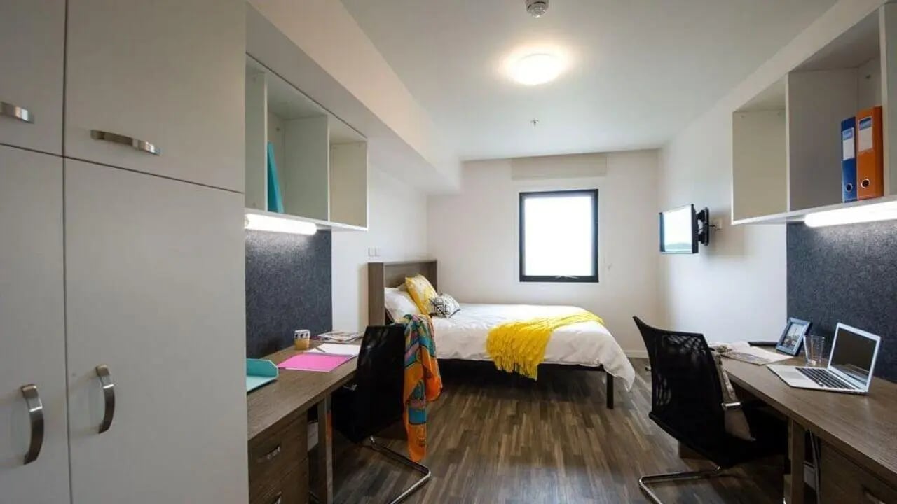 Bed desks storage tv window bedroom at UniLodge Darwin in Darwin Student Accommodation