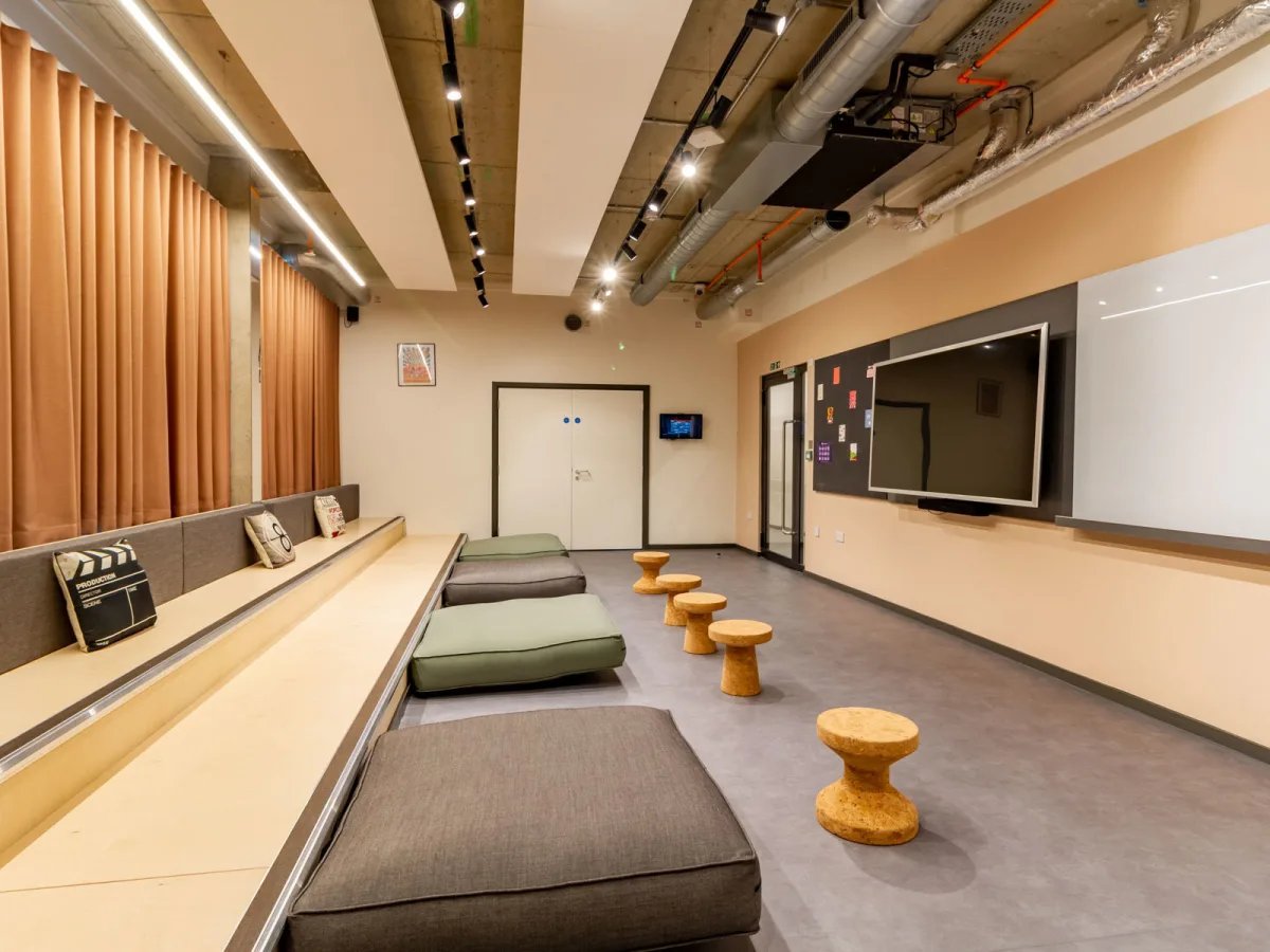Tiered seating large TV and whiteboard communal area at The Tannery Leicester in Leicester Student Accommodation