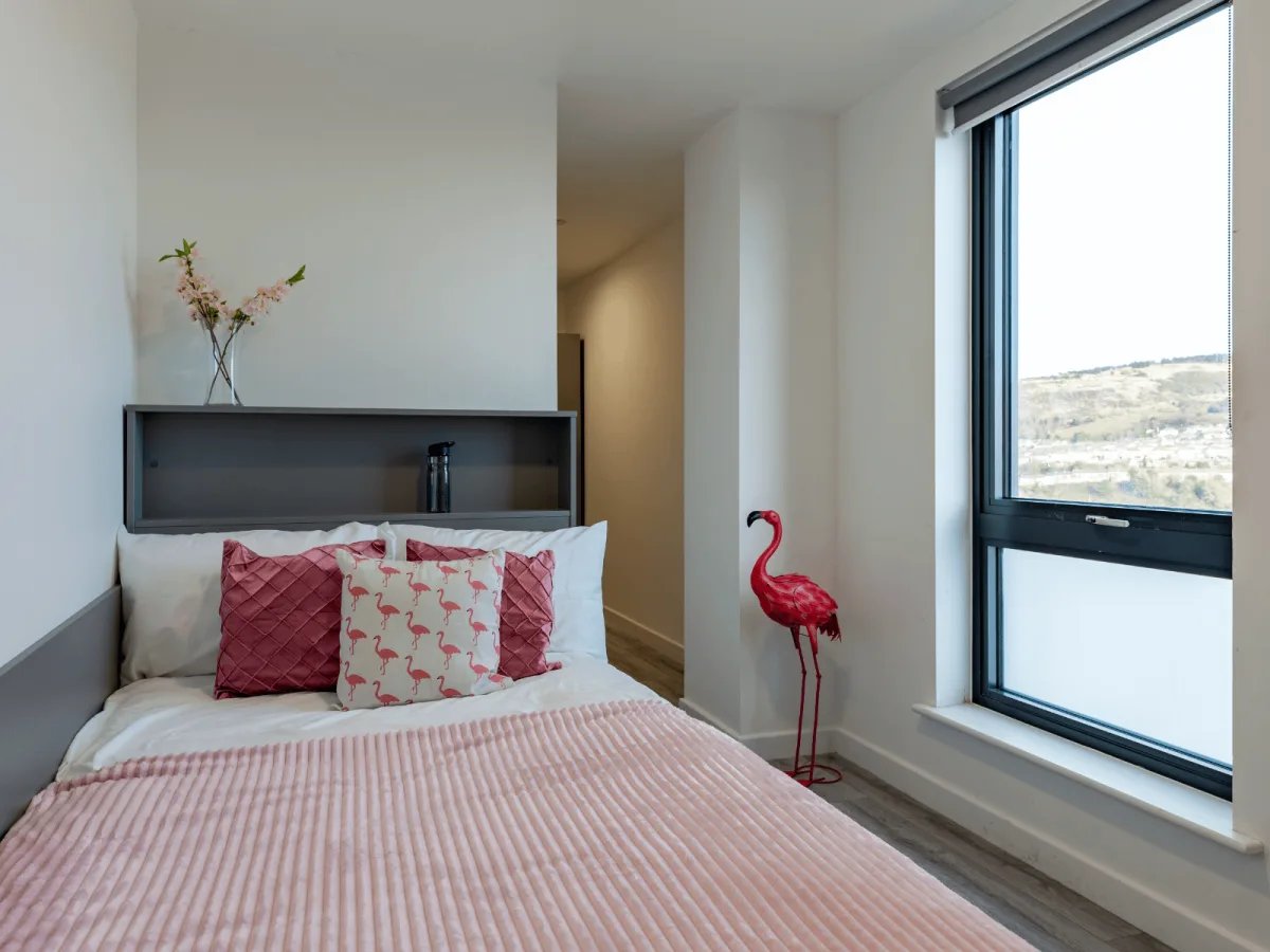 Pink flamingo statue by window bedroom at The Oldway Centre in Swansea Student Accommodation