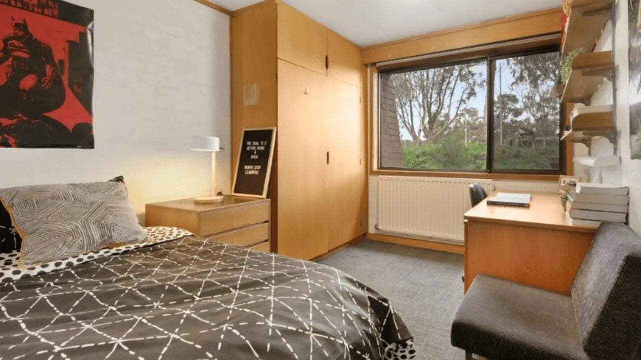 Bed desk wardrobe view bedroom at La Trobe University - Chisholm College in Melbourne Student Accommodation