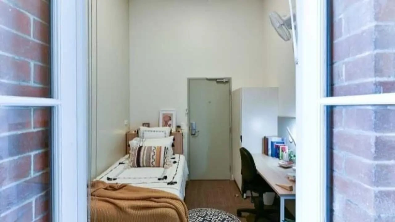 Bed desk and wardrobe in dorm room at UniLodge Herston in Brisbane Student Accommodation