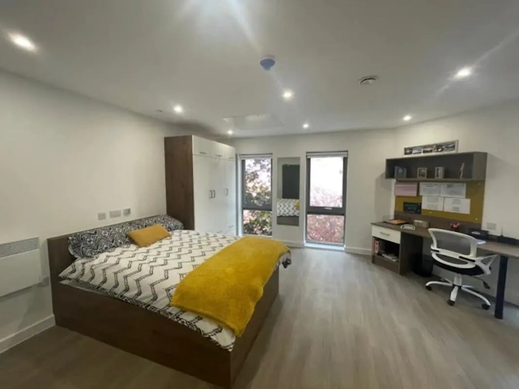 Bed wardrobe desk chair window bedroom at The Oaks in Coventry Student Accommodation