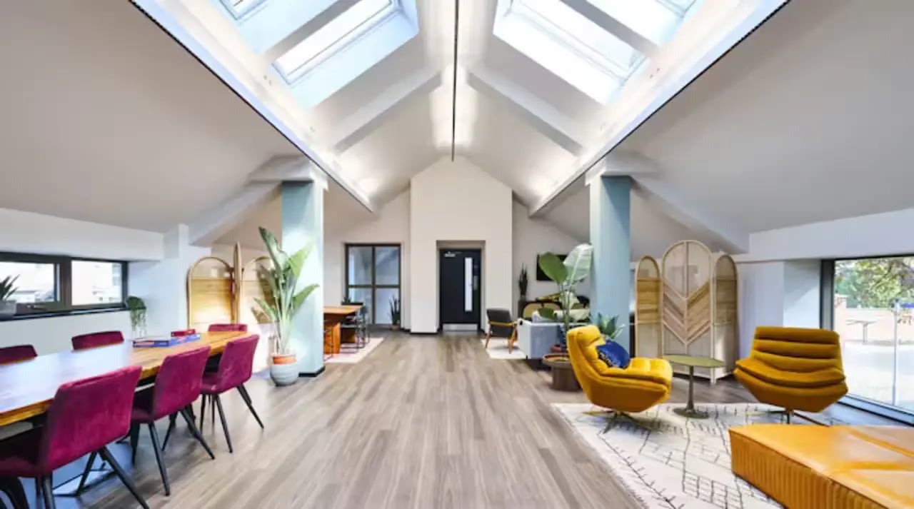Dining table plush chairs skylights living area at Frederick House in York Student Accommodation