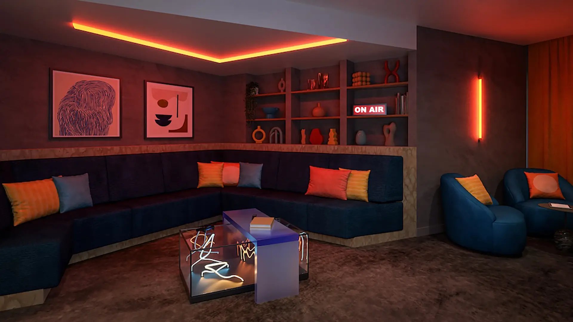 Blue sectional sofa with colorful cushions living room at Ironworks House in London Student Accommodation