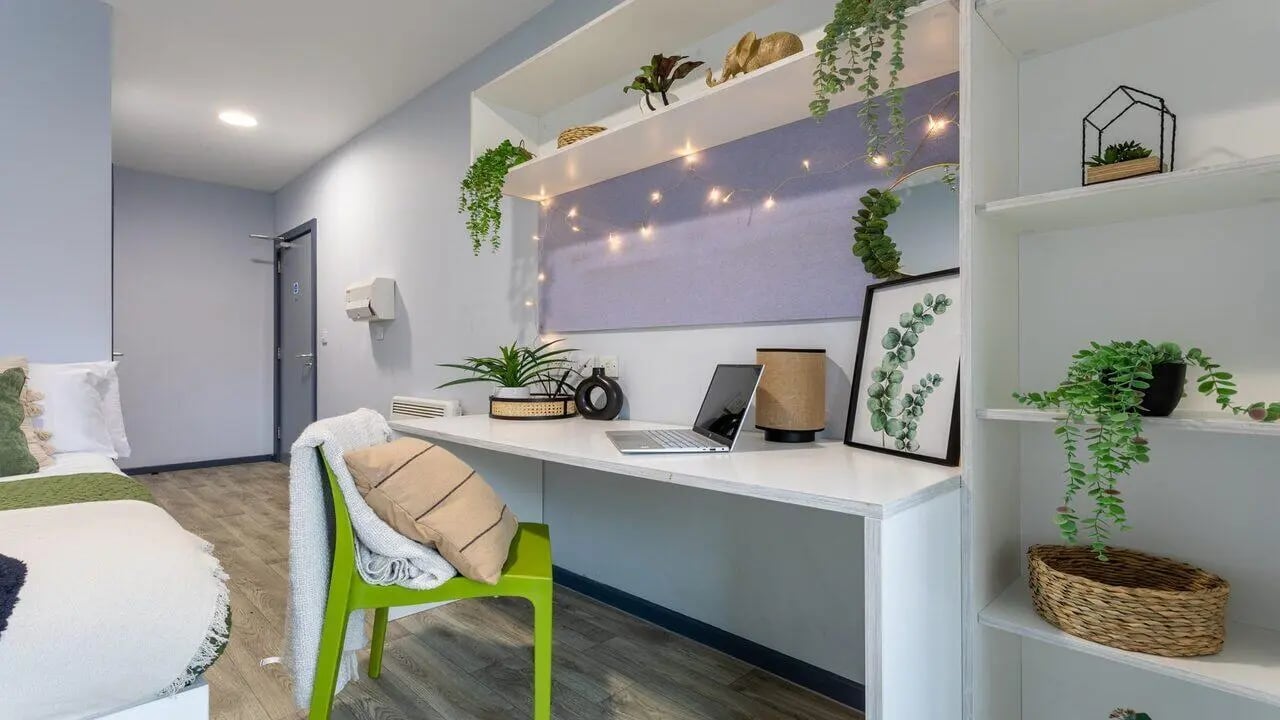 Desk with laptop plants and chair study area at dwell Archer House in Nottingham Student Accommodation