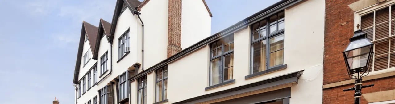 Tiled roofs and windows on cream building exterior at dwell Castle Gate Haus in Nottingham Student Accommodation