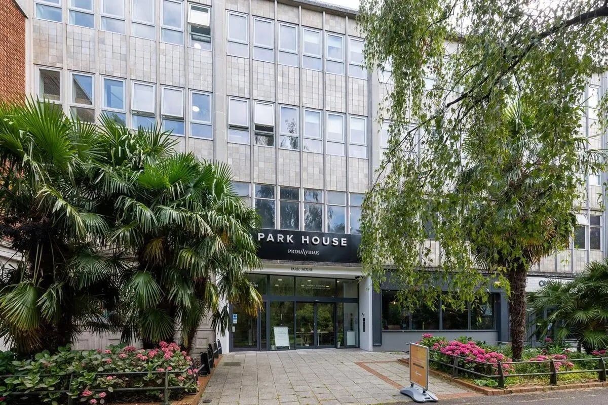 Park House sign trees and flowers exterior at Collegiate Park House in Southampton Student Accommodation