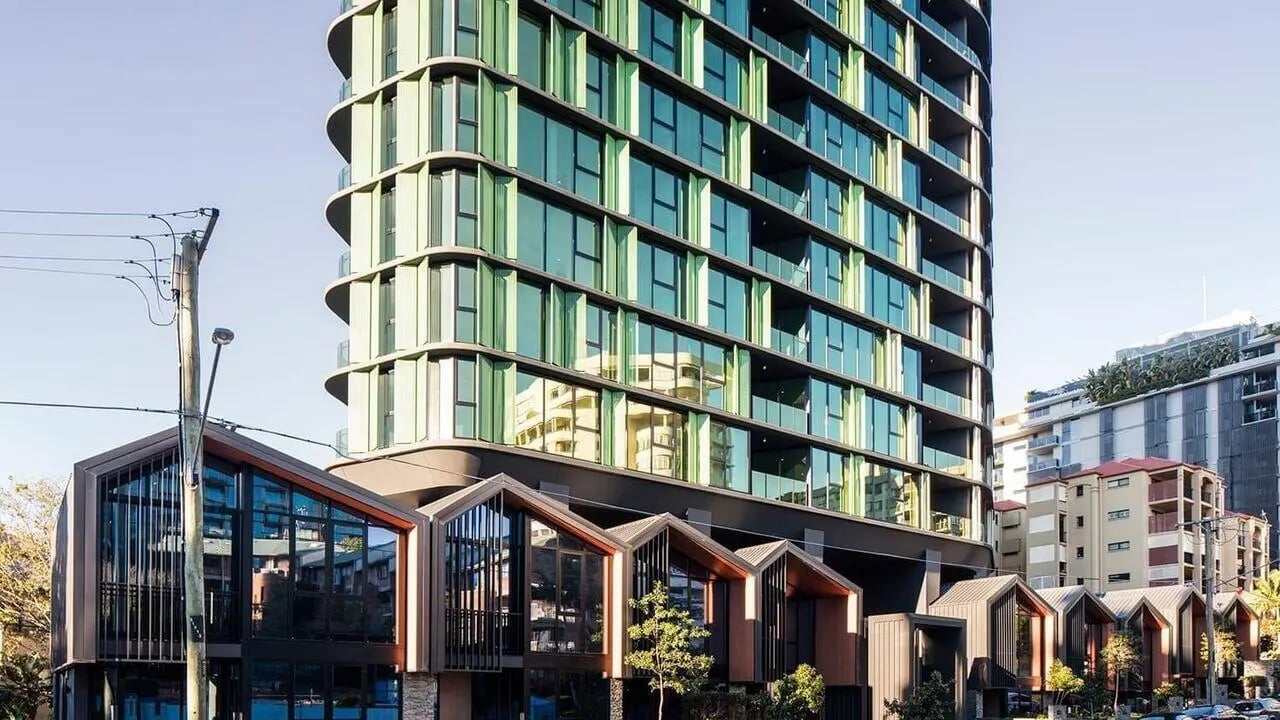 Modern apartments with green facades and gabled roofs exterior at Realm Kangaroo Point in Brisbane Student Accommodation