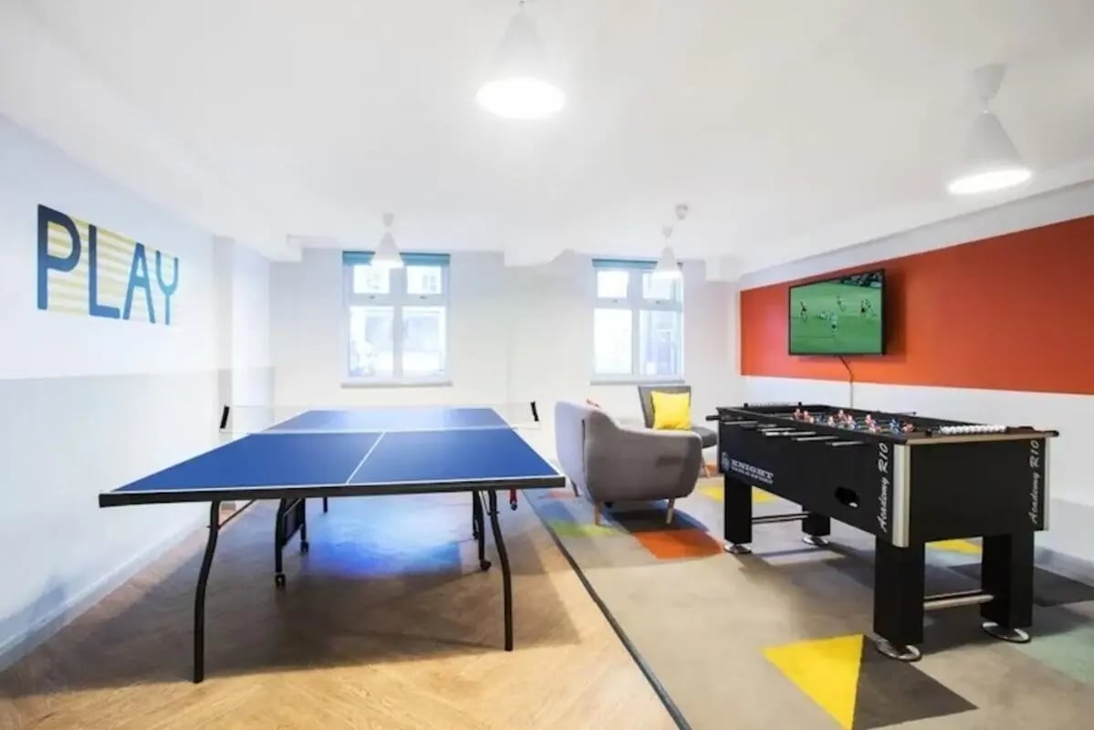 Ping pong table foosball table television couch play area at St Martins House in Leicester Student Accommodation