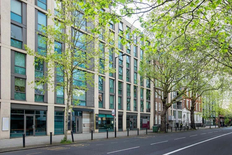 Modern building with large windows and trees exterior at Wellington Lodge in London Student Accommodation