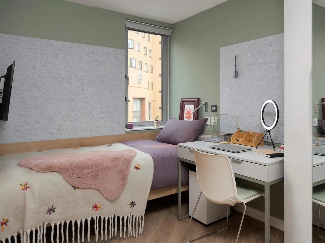 Bed desk ring light and chair bedroom at The Curve in London Student Accommodation