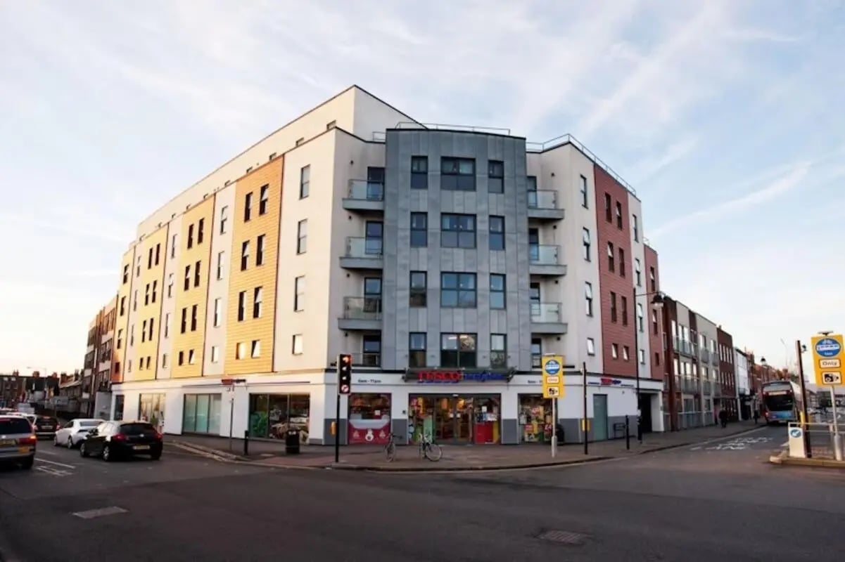 Modern apartment building with shops below exterior at Crown House - Reading in Reading Student Accommodation