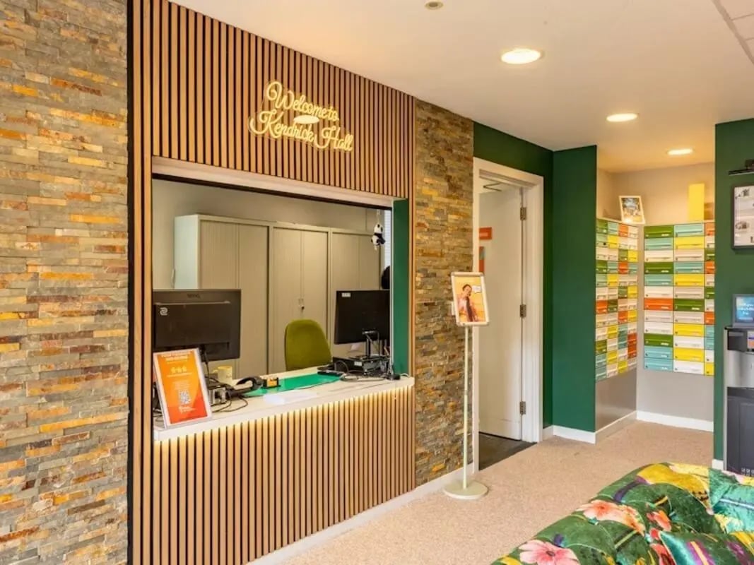 Reception desk with computers and mailboxes lobby at Kendrick Hall in Reading Student Accommodation