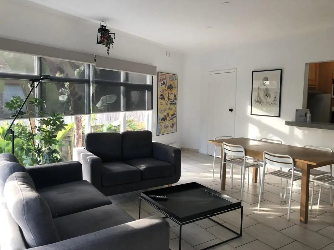 Two gray sofas and coffee table living room at Classical House in Melbourne Student Accommodation