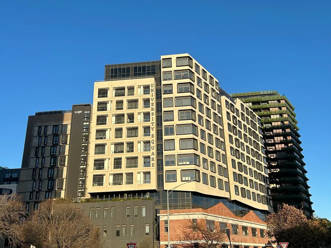 Student accommodation buildings with visible signage exterior. at Yugo University Square Melbourne in Melbourne Student Accommodation