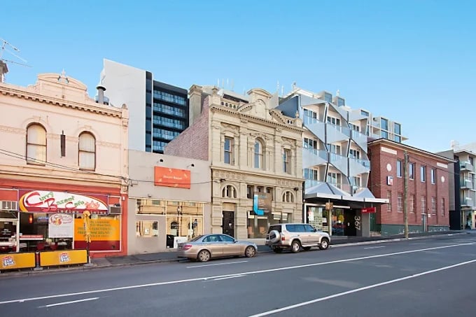 Commercial buildings and modern apartment exterior at Student Living - Vivida in Melbourne Student Accommodation