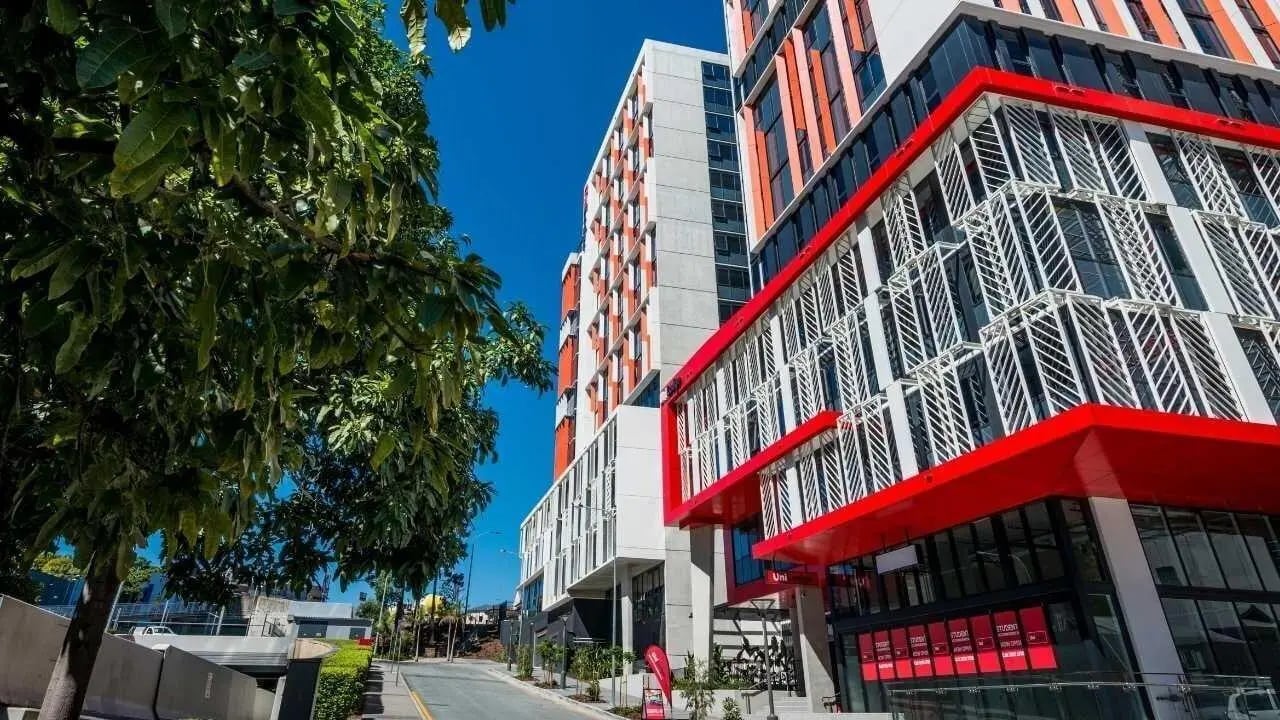 Modern student accommodation building red accents exterior at Unilodge South Bank in Brisbane Student Accommodation