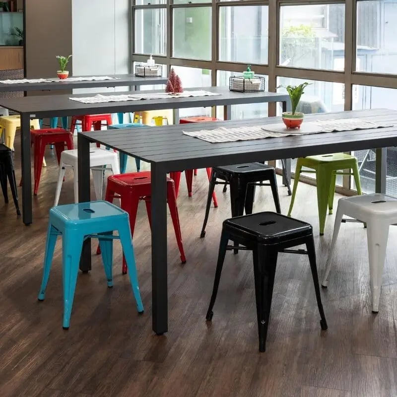 Colorful stools around black dining tables communal area at Sydney Student Living Concord in Sydney Student Accommodation