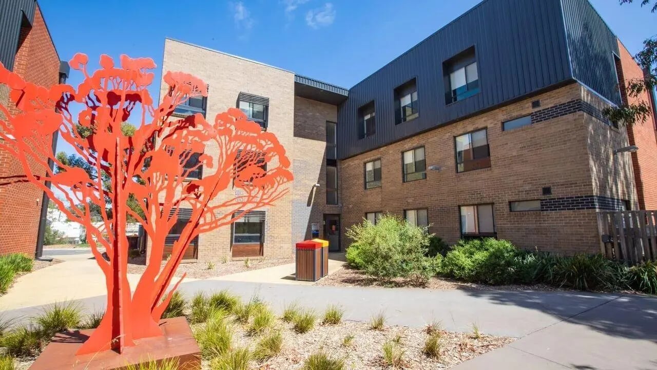 Orange tree sculpture building exterior and pathways exterior at La Trobe University - Hillside Apartments in Melbourne Student Accommodation