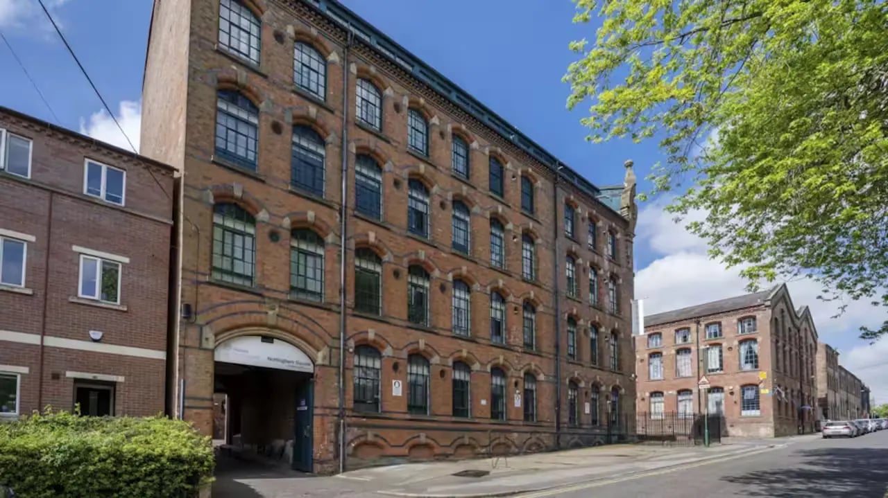 Brick building with arched entrance and windows exterior at Nottingham Square in Nottingham Student Accommodation