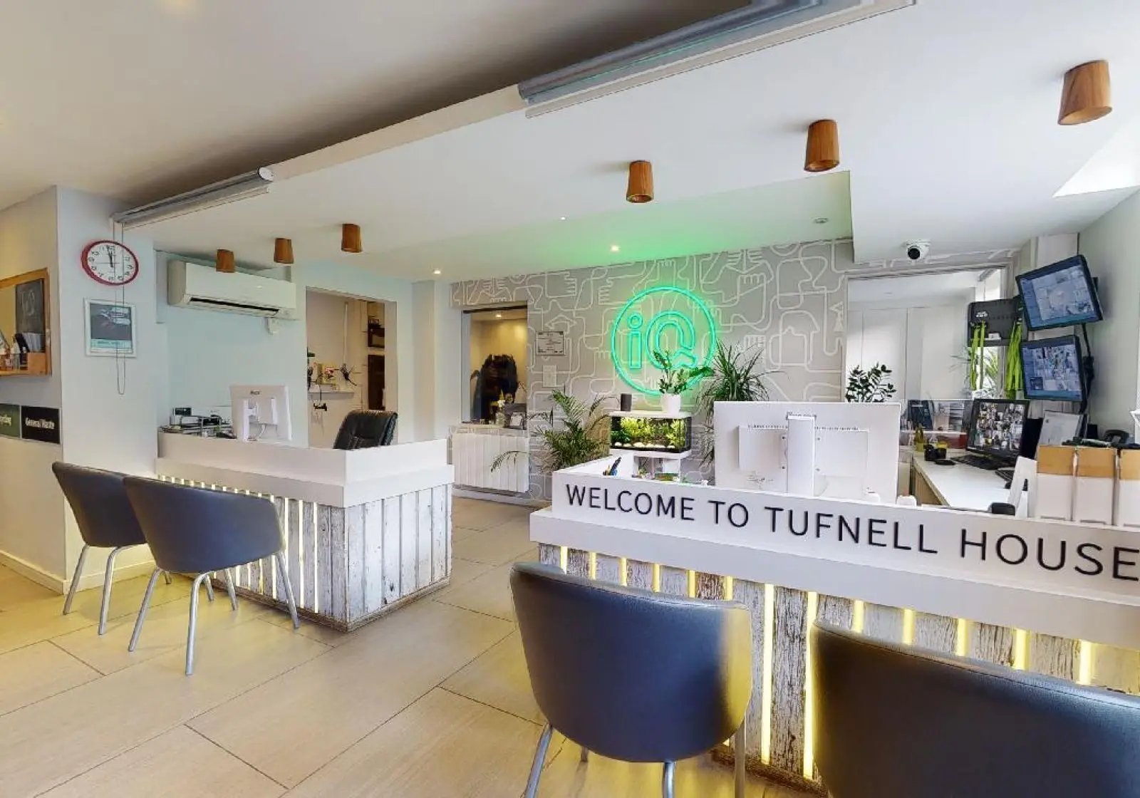 Reception desk with monitors and aquarium reception area at iQ Tufnell House in London Student Accommodation