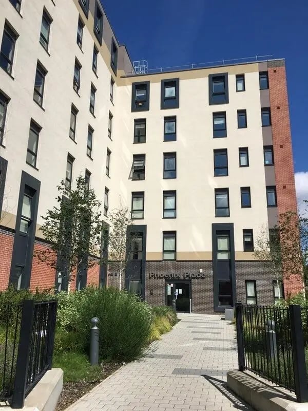 Phoenix Place building with tiled walkway and landscaping exterior at Phoenix Place in Liverpool Student Accommodation