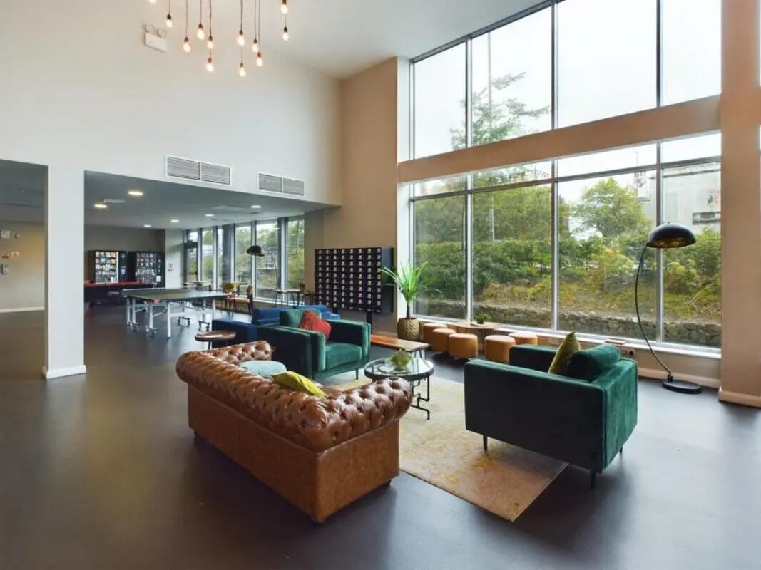 Sofas, ping pong table, lockers common area at One Islington Plaza in Liverpool Student Accommodation