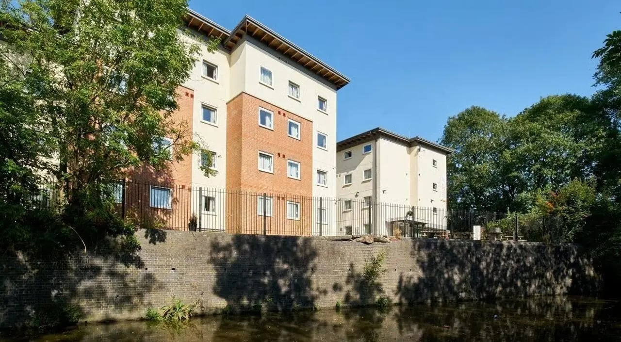 Modern student buildings with balconies and greenery exterior at College Court in Stoke-On-Trent Student Accommodation